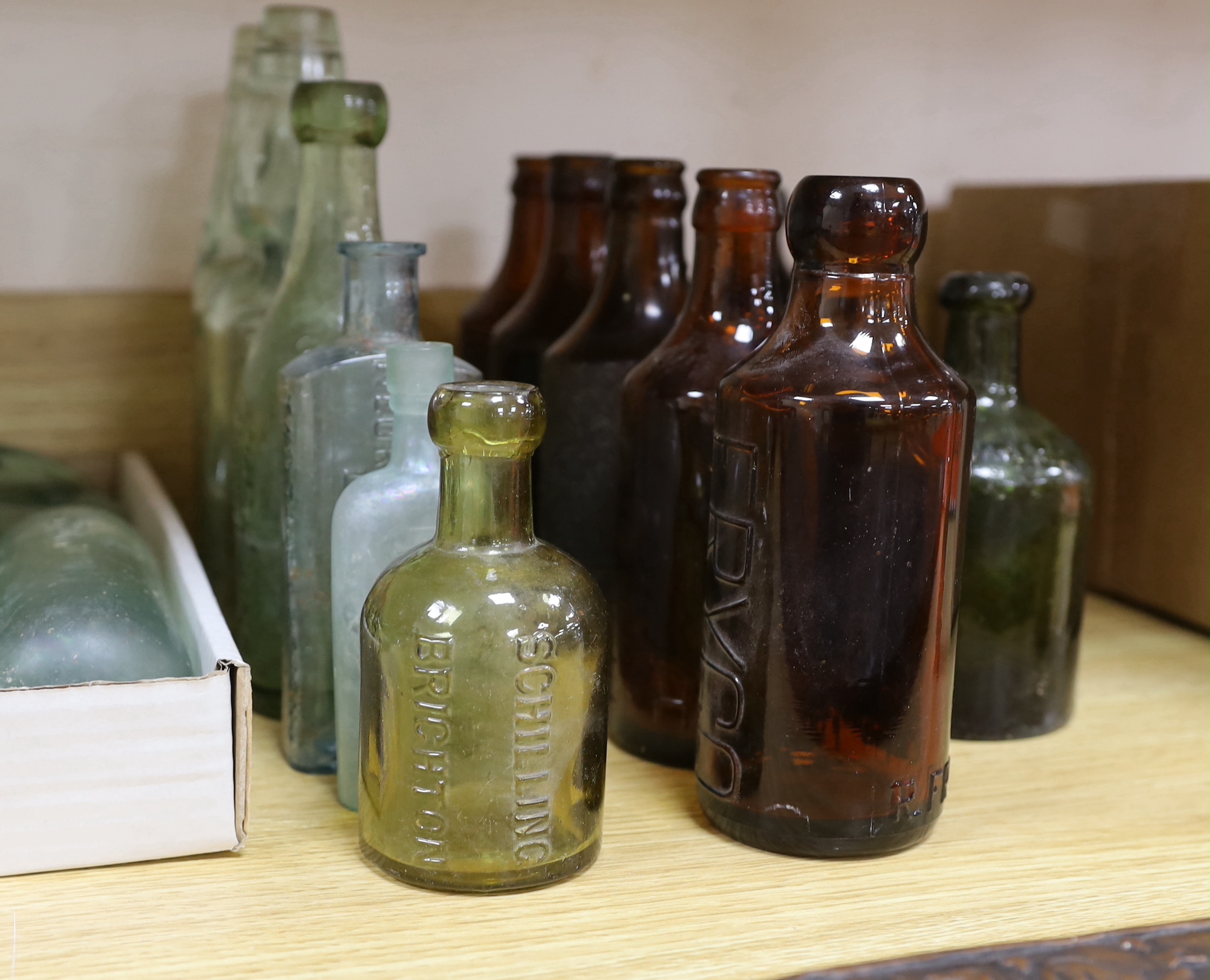 A quantity of early to mid 20th century glass bottles
